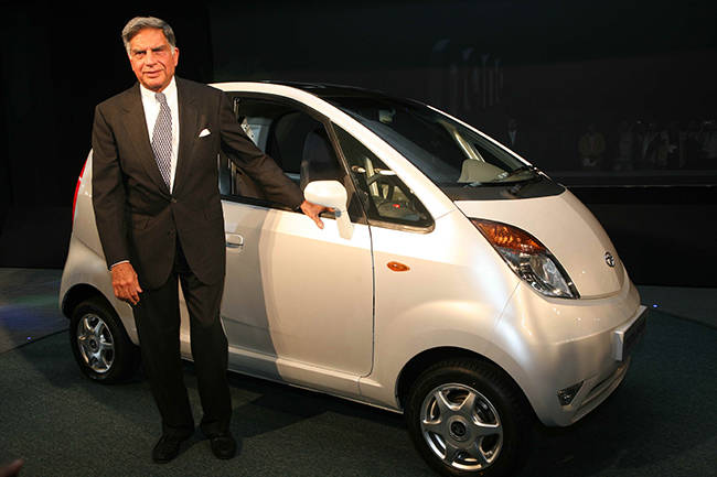 Ratan Tata with the first-gen Nano compact car 