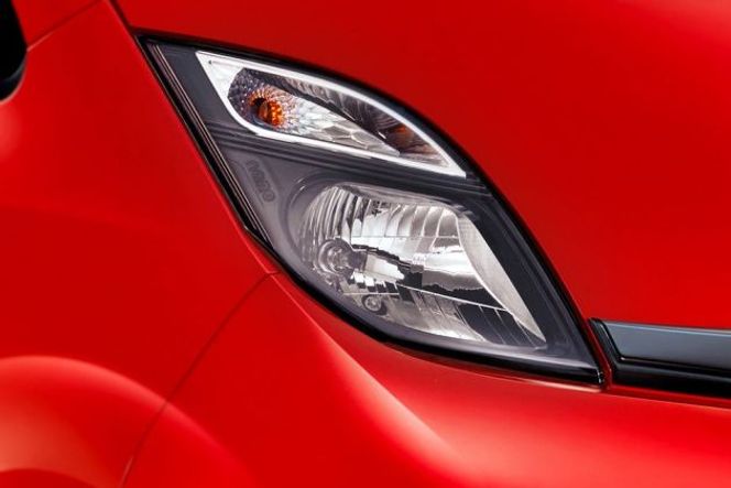 Tata Nano Giving the Nano a confident face are the pair of smoked headlamps. The black blaze on them only enhances the car's front look.