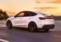 Tesla Model Y Driving: Rear Left Three Quarter View