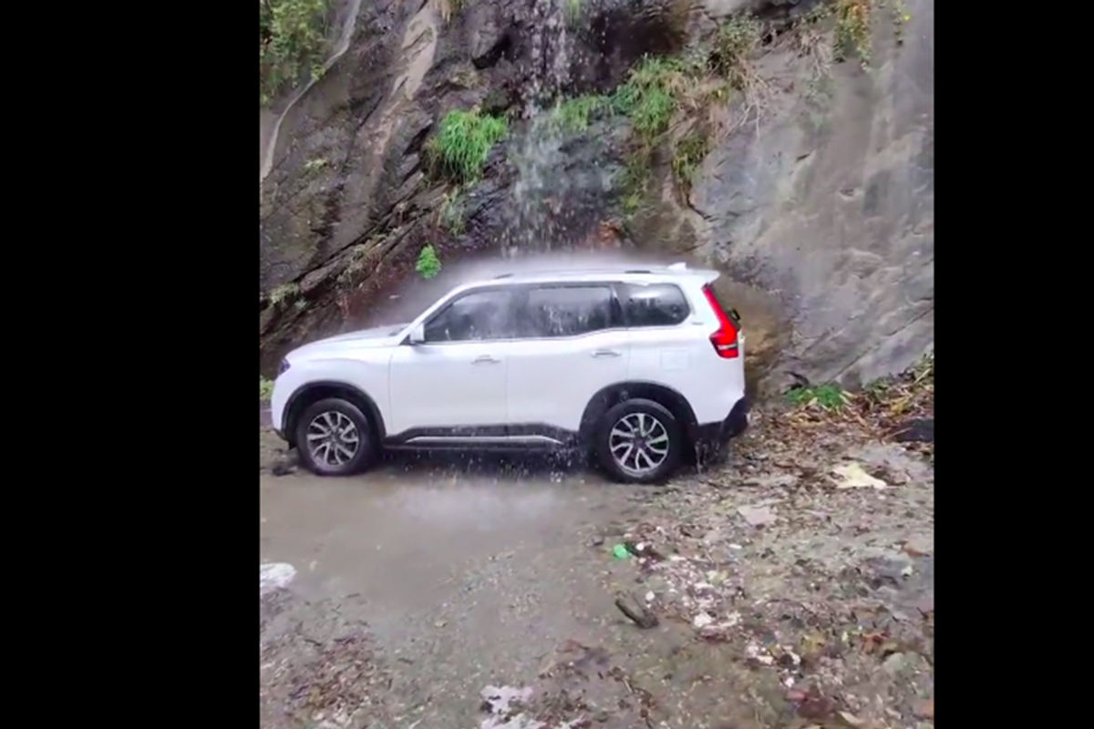 Mahindra Scorpio N under a waterfall Mahindra Scorpio N under a waterfall
