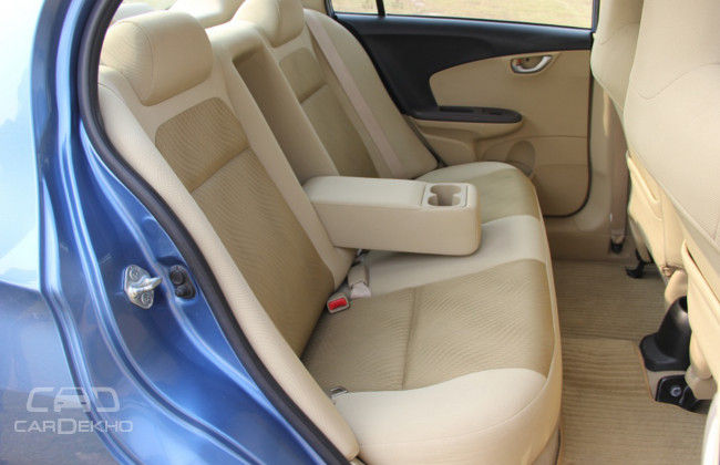 Honda's seats can hold three passengers; light colours makes the rear cabin feel airy; longer armrest more comfortable than the Sail Honda's seats can hold three passengers; light colours makes the rear cabin feel airy; longer armrest more comfortable than the Sail