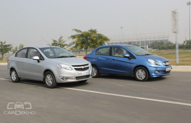 Honda feels light and nimble with a nicer steering; Sail holds the road well but the steering feels very disconnected Honda feels light and nimble with a nicer steering; Sail holds the road well but the steering feels very disconnected