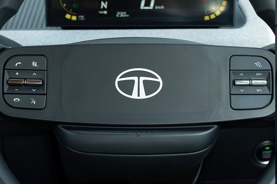 Tata Tiago steering wheel hub with airbag cover and mounted control buttons