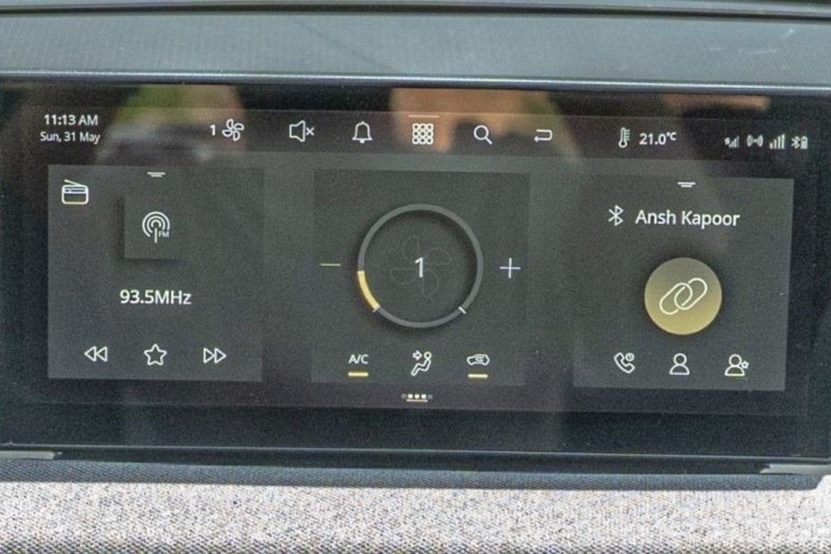 Tata Tiago touchscreen showing radio, AC fan and Bluetooth phone panels