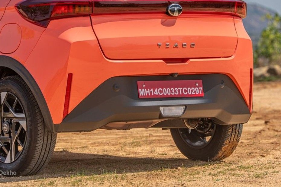 Tata Tiago rear bumper, tailgate badge and alloy wheel in orange paint