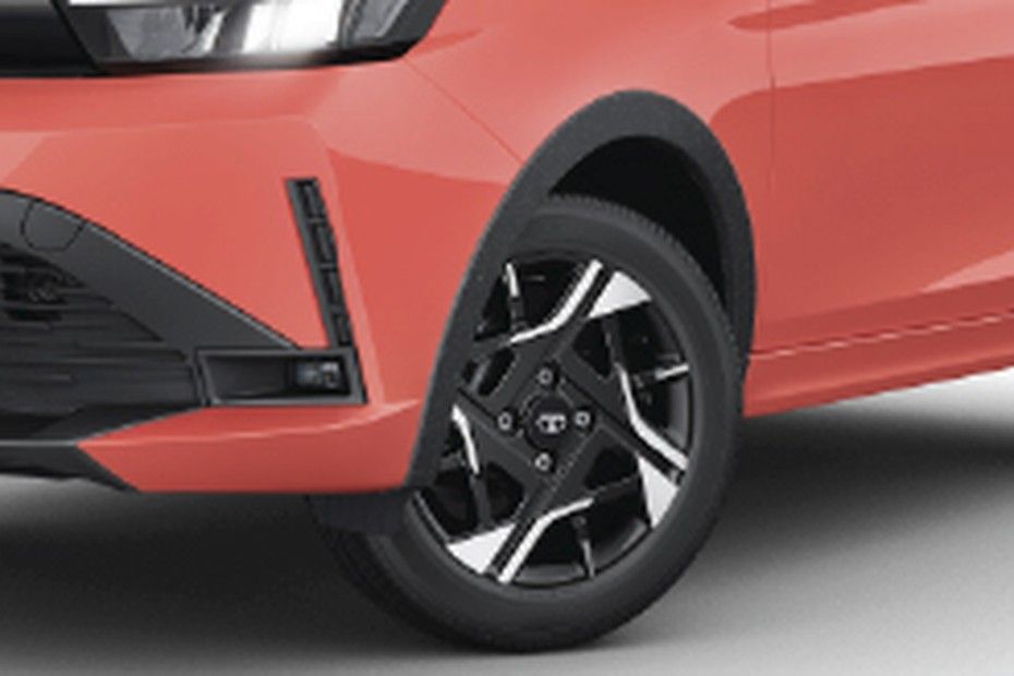 Tata Tiago front wheel arch with black textured cladding and two-tone alloy wheel