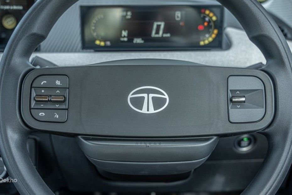 Tata Tiago steering wheel with spoke-mounted buttons and digital cluster behind