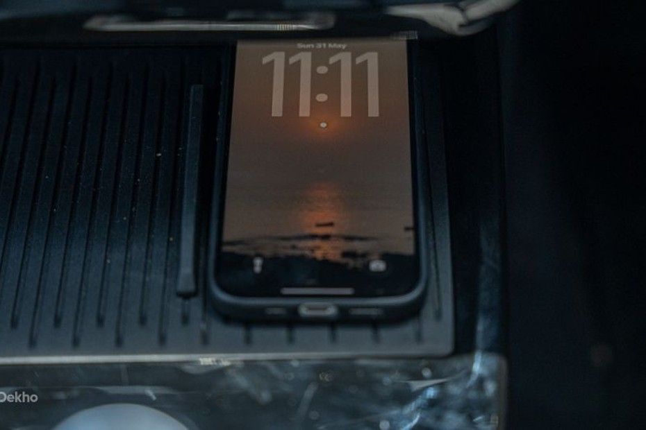 Tata Tiago wireless charging pad in the centre console with a phone on it
