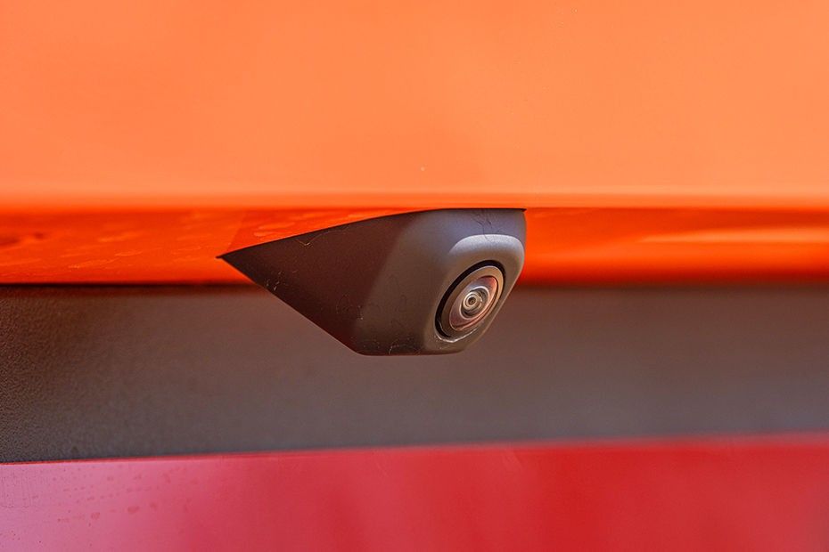 Tata Tiago rear camera lens mounted under the tailgate on orange bodywork