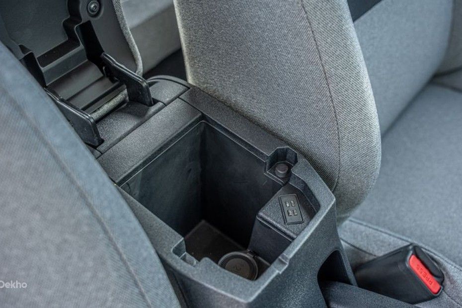 Tata Tiago front armrest opened, showing storage bin with USB ports and 12V socket