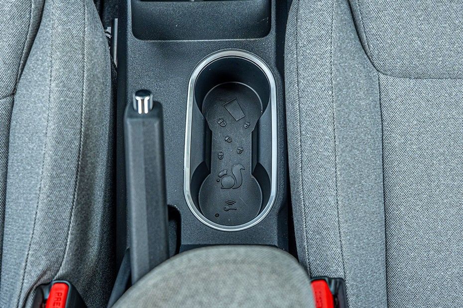 Tata Tiago twin front cupholders in centre console beside handbrake lever