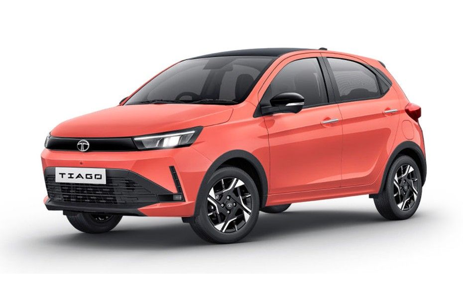 Tata Tiago in coral-orange with black roof, front three-quarter view, white background