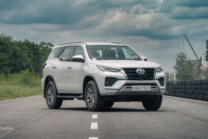Toyota Fortuner in white parked on a test track, front three-quarter view Toyota Fortuner in white parked on a test track, front three-quarter view