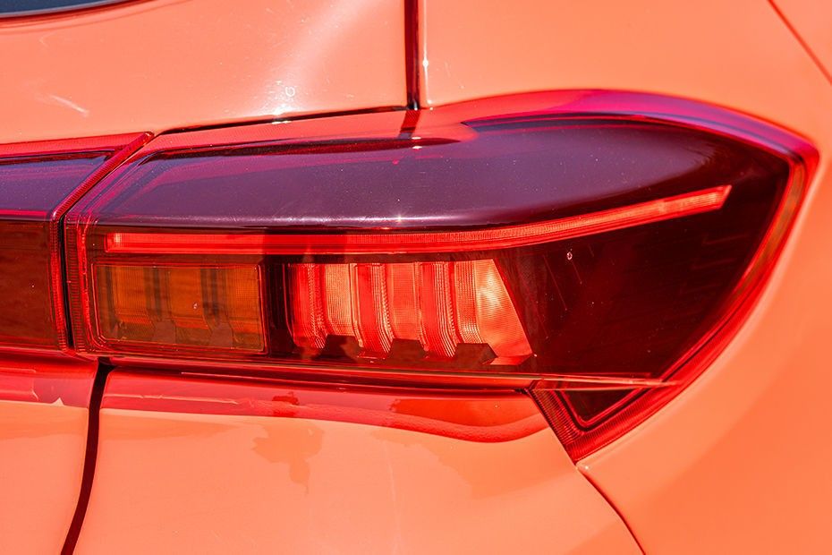 Tata Tiago LED tail lamp close-up on orange body panel