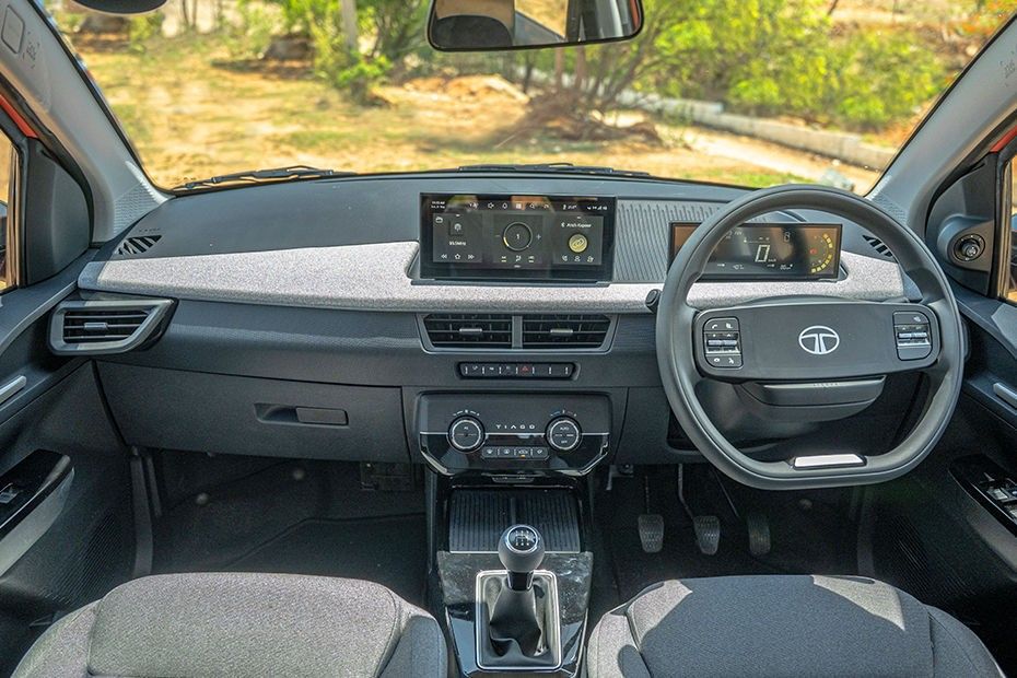 Tata Tiago dashboard with touchscreen, digital cluster, steering wheel and manual gear lever