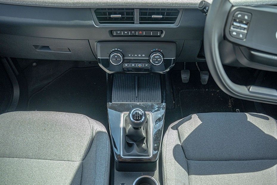 Tata Tiago centre console with climate knobs, phone deck and manual gearlever