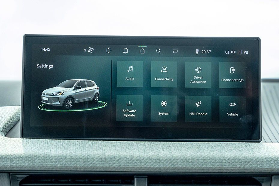 Tata Tiago touchscreen showing settings menu with audio, connectivity and vehicle tiles