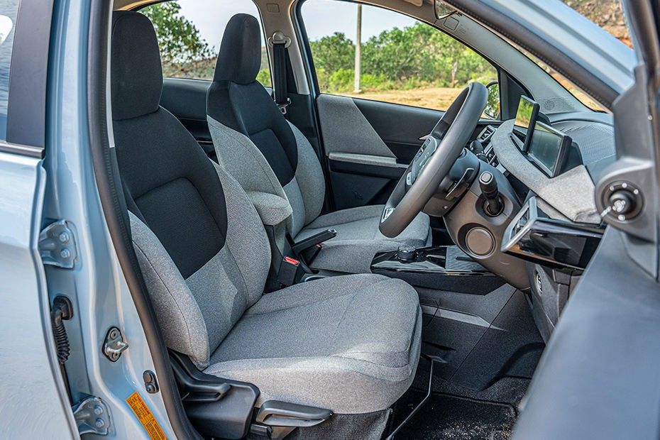 Tata Tiago front seats in grey fabric seen through open passenger door