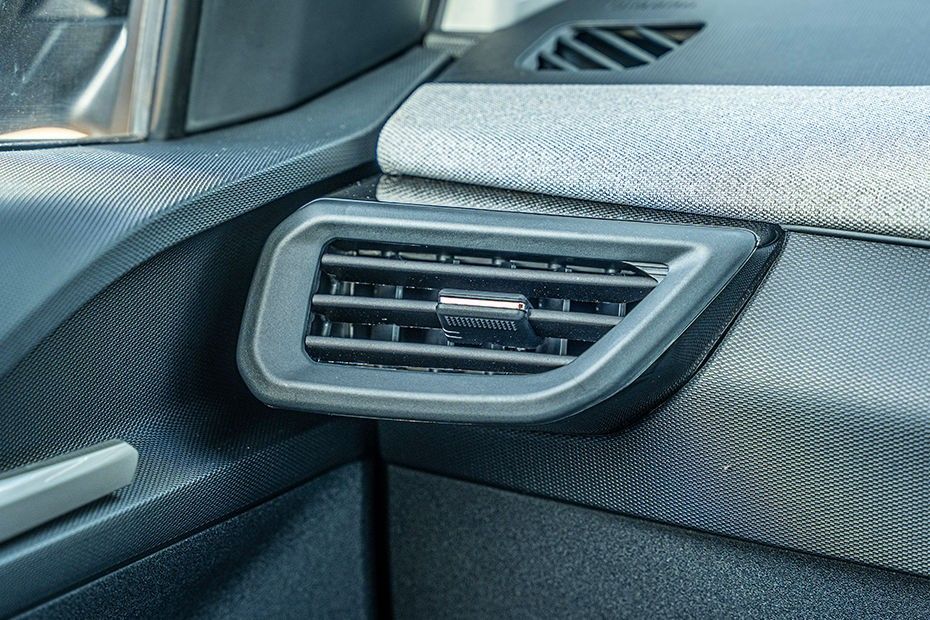 Tata Tiago dashboard side AC vent with adjuster tab and fabric trim