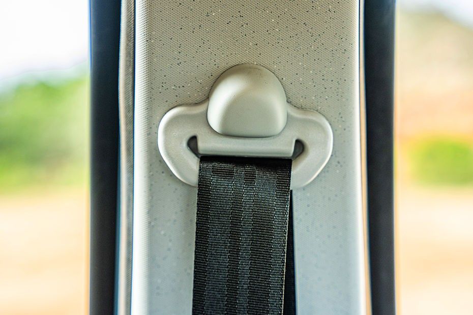 Tata Tiago front seatbelt emerging from speckled grey pillar trim