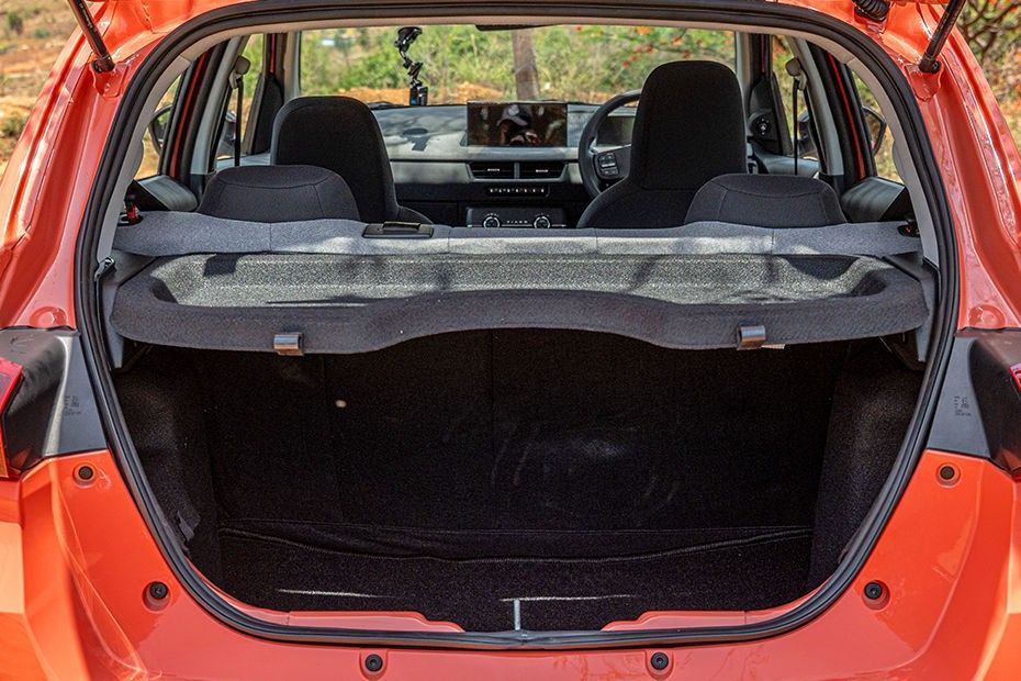 Tata Tiago open boot with parcel shelf, orange body, view through to dashboard
