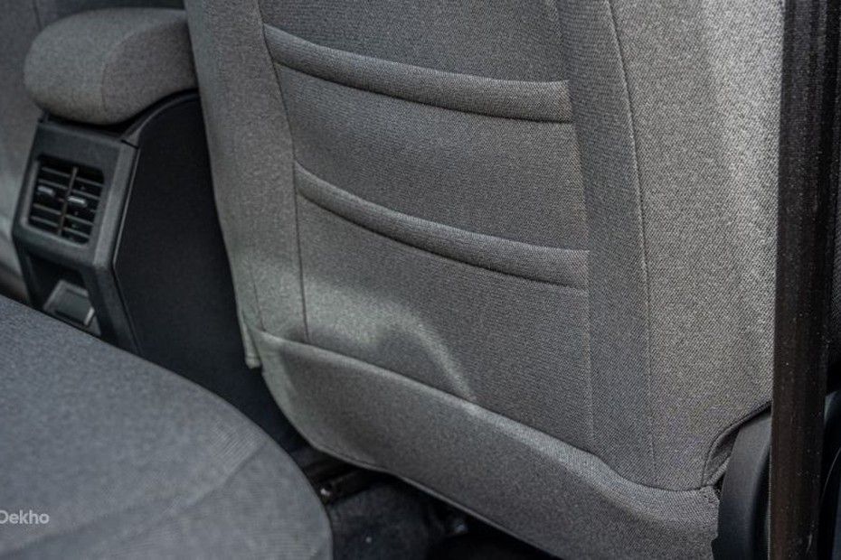 Tata Tiago front seatback with stitched pockets and rear AC vents behind console